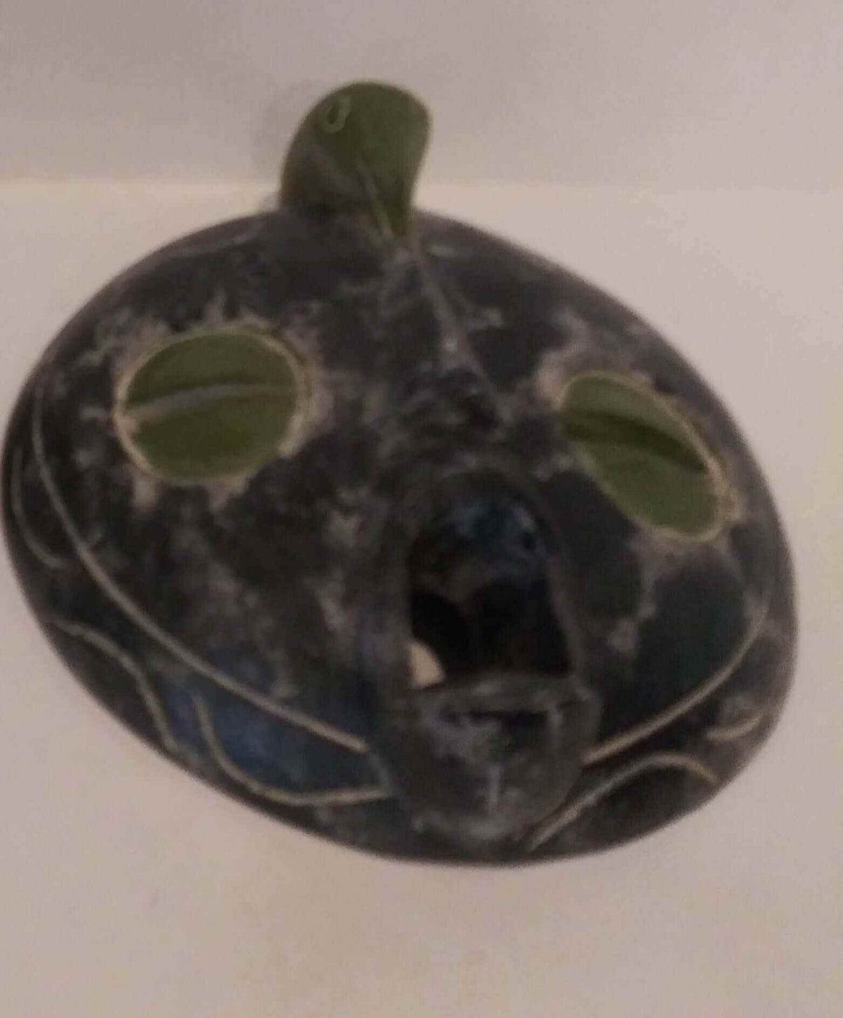 Decorative round large mask with intricate carvings and bold design for interior walls
