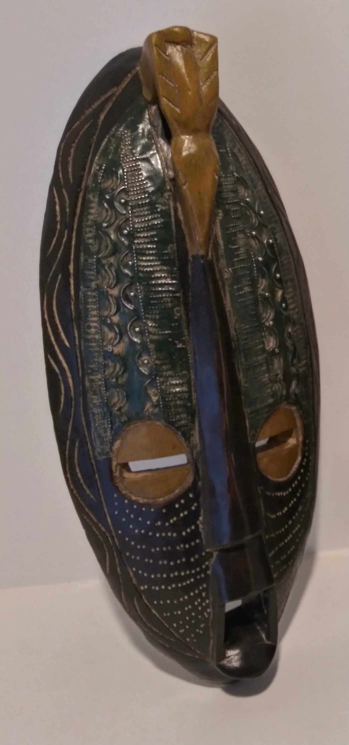 Handcrafted long wall mask with African tribal design, carved wood and intricate patterns, for cultural and elegant home décor.
