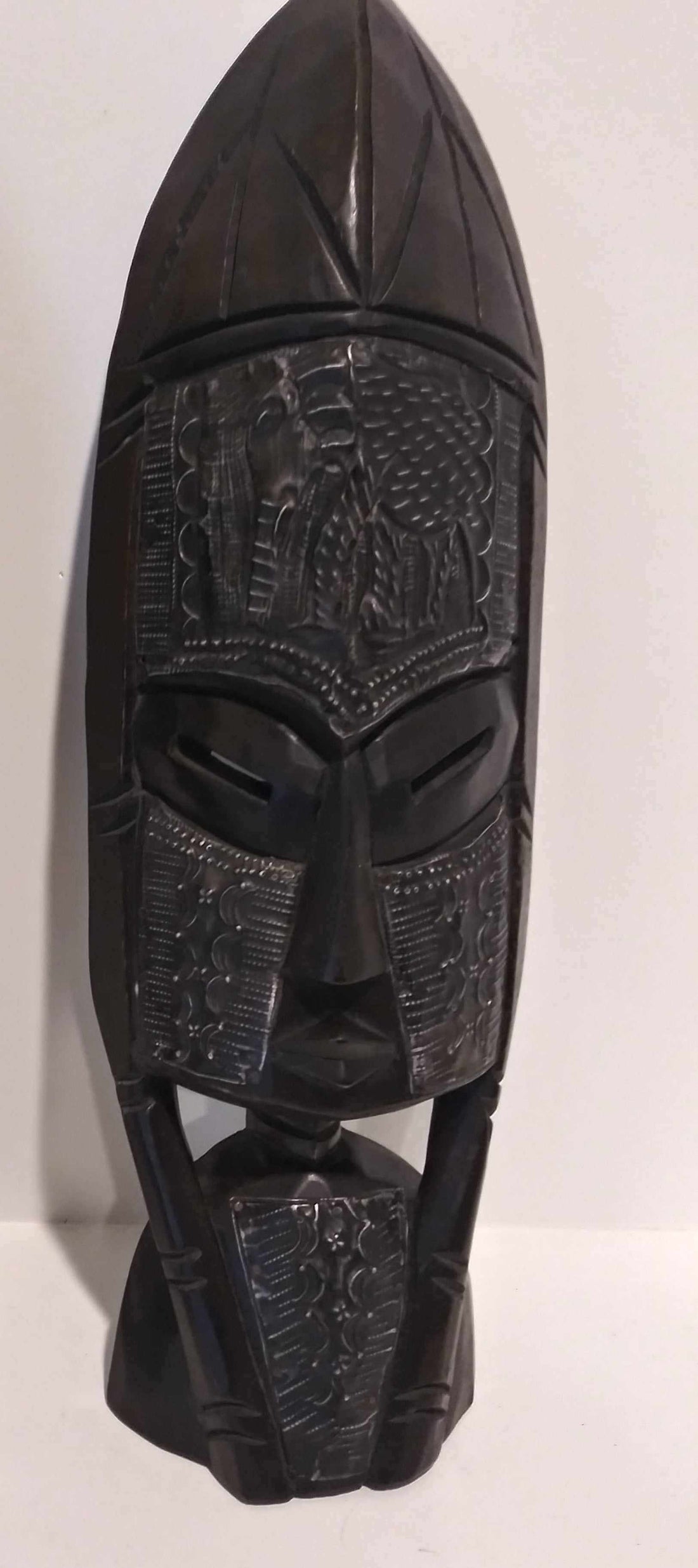 Handcrafted African tribal wall mask with intricate traditional designs for cultural wall decor