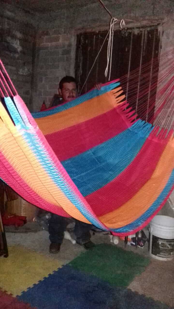 comfortably relaxing in a colorful comfortable indoor outdoor hammock for ultimate relaxation