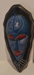 Handcrafted African wall mask with traditional tribal patterns and rich cultural symbolism