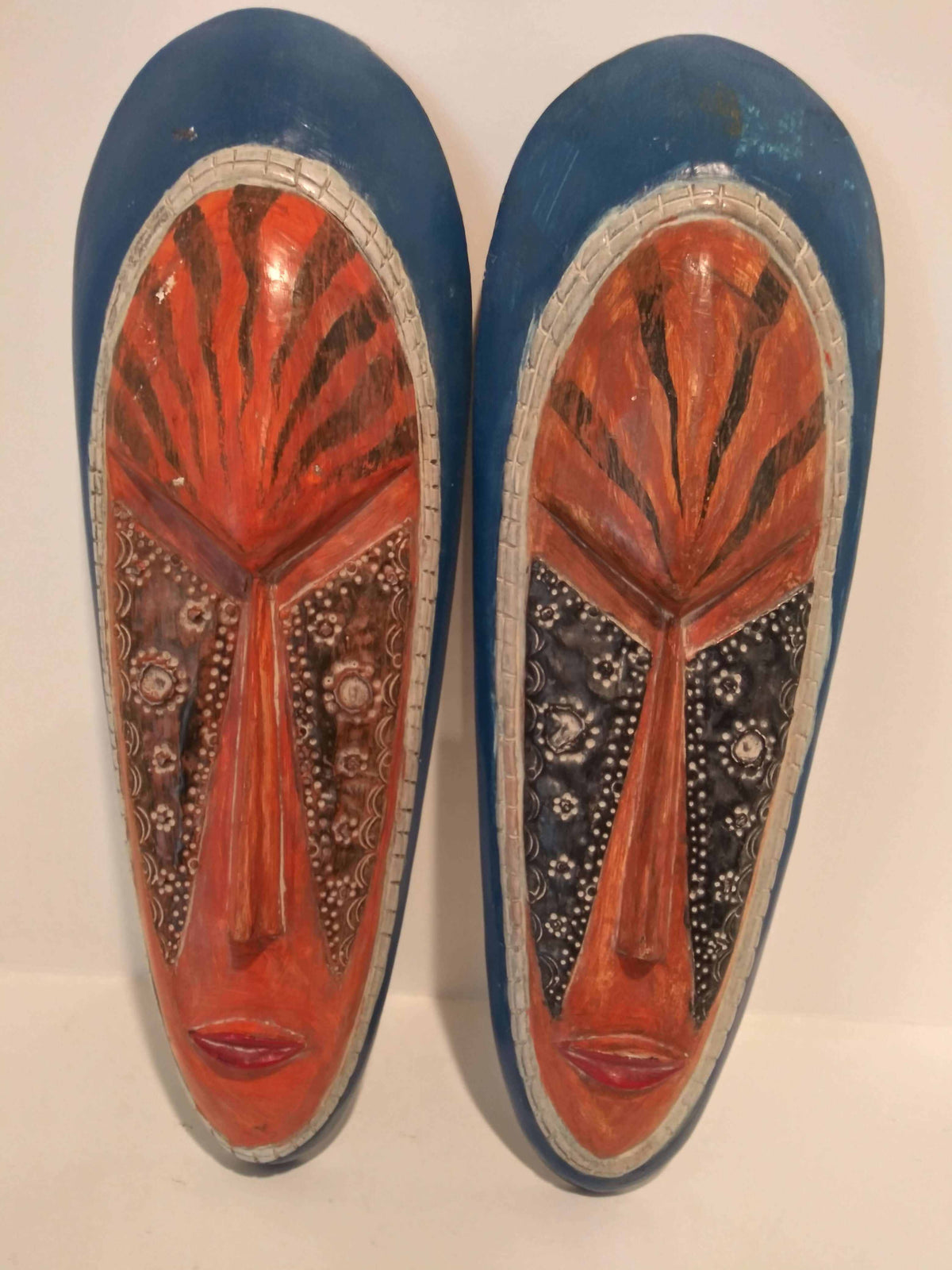 Authentic African tribal mask showcasing detailed craftsmanship and vibrant colors, representing cultural heritage.