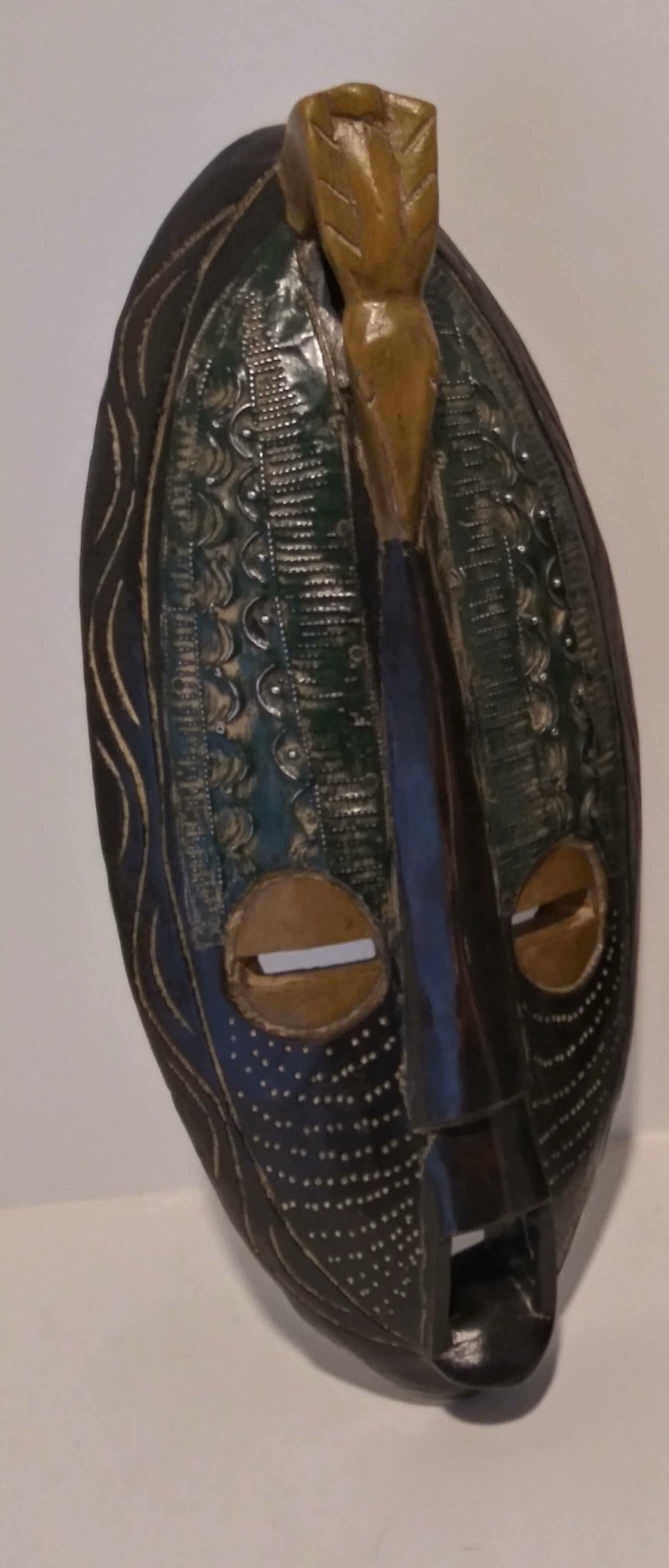 Long wall mask inspired by African tribal artistry, handcrafted with intricate carvings and unique tribal patterns.