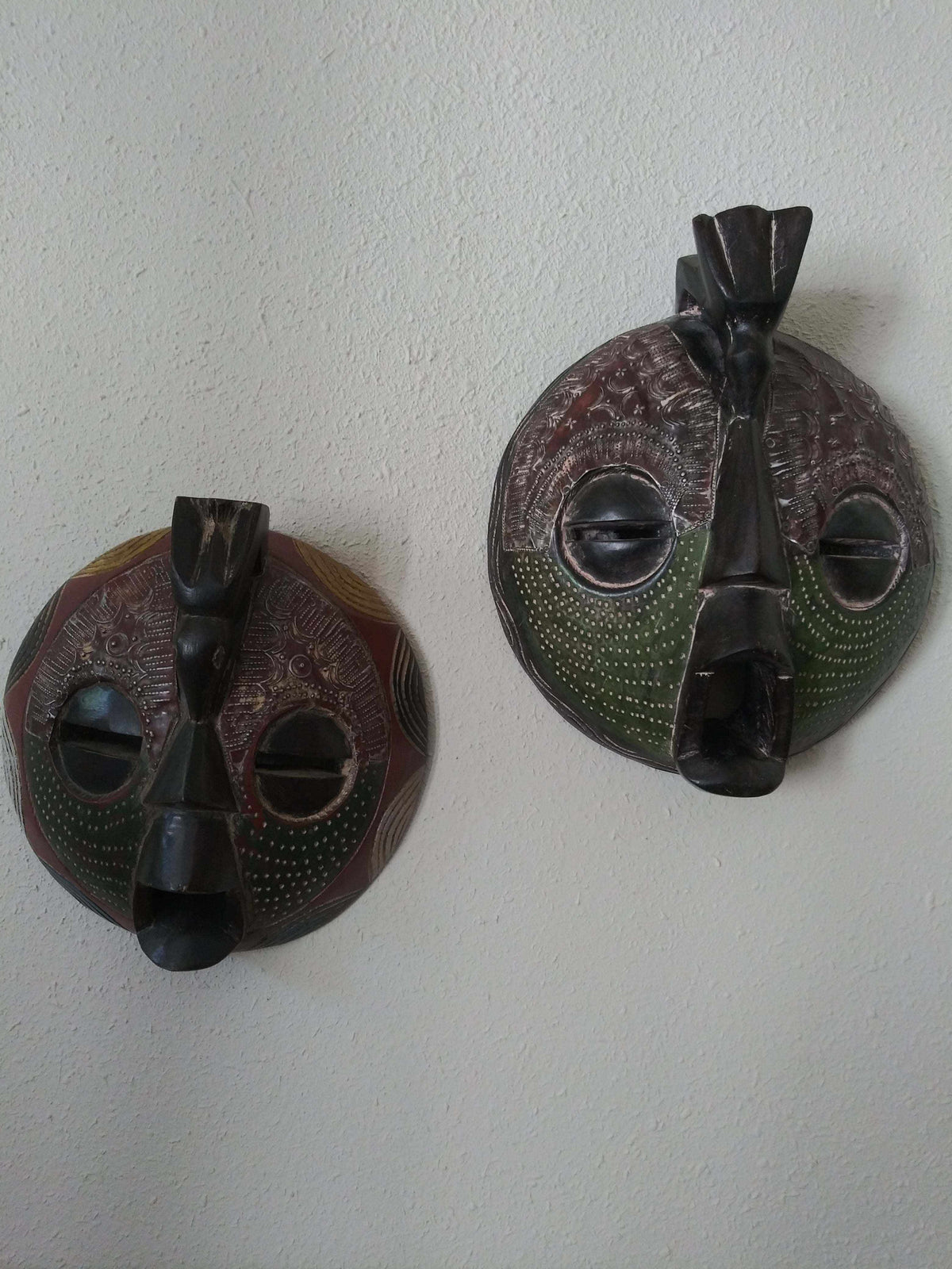 Handcrafted Round Lovers Mask with tribal patterns, symbolizing unity and love, for home décor.