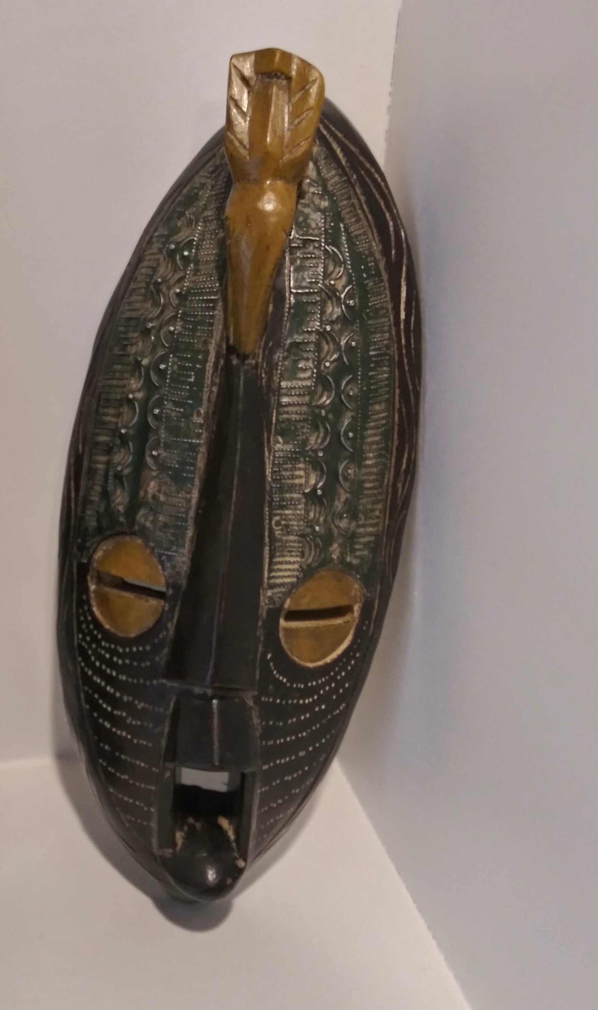 Handcrafted African tribal long wall mask, elegant home decor with intricate carvings and unique patterns.