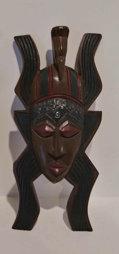 African handcrafted mask with intricate tribal patterns and traditional wood carving