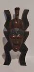 African handcrafted mask with intricate tribal patterns and traditional wood carving