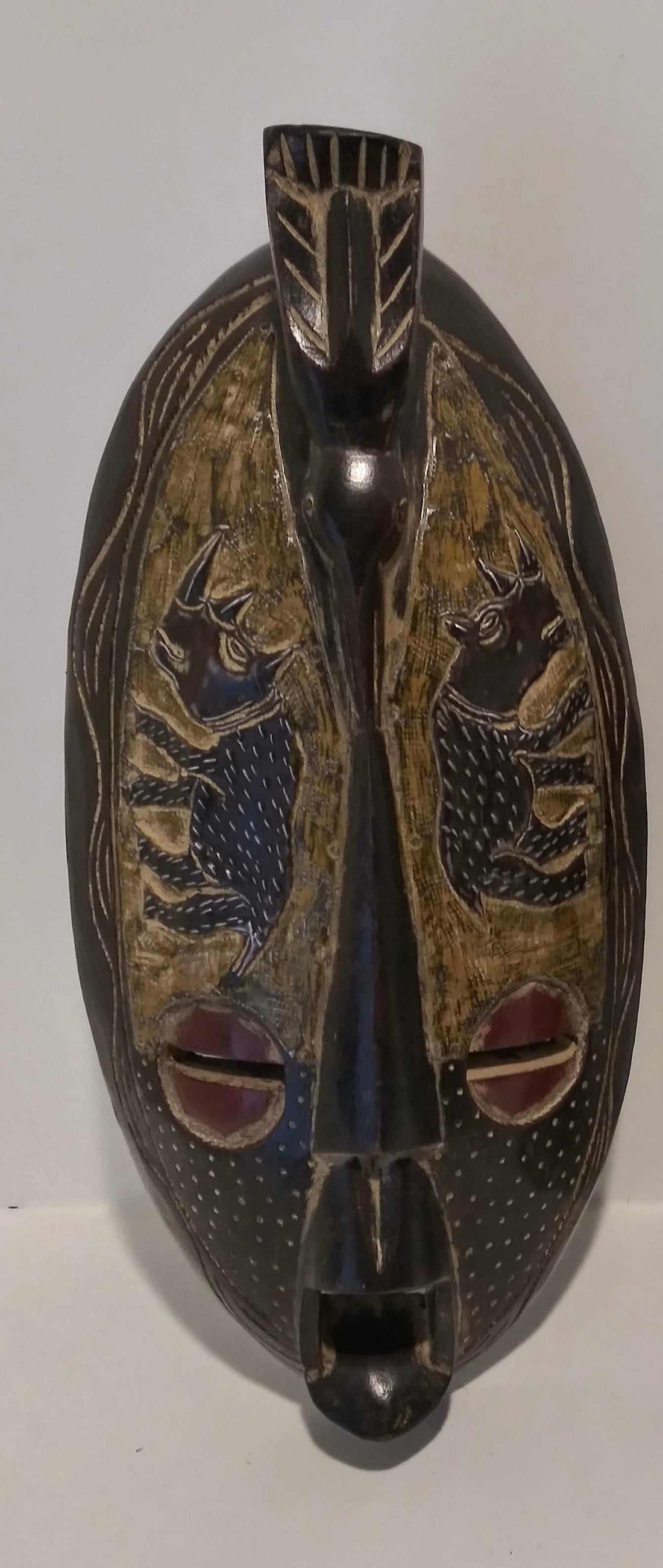 Handcrafted long wall mask with African tribal design symbolizing heritage and spirituality