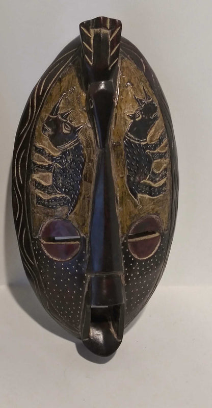 Handcrafted African-inspired long wall mask with tribal patterns, symbolizing heritage and spirituality.