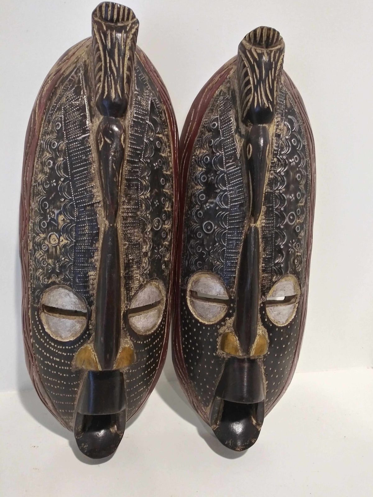 Handcrafted long wall masks with African tribal design in high-quality wood and unique patterns.
