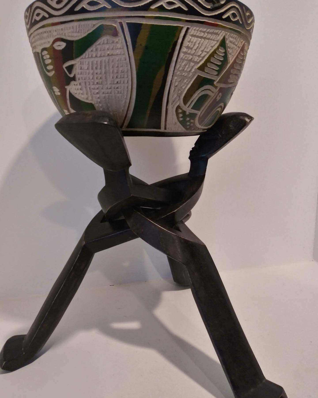 Handcrafted African bowl décor with intricate carvings, showcasing traditional African artistry and craftsmanship.